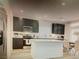 Contemporary kitchen features stainless steel appliances and a center island, perfect for meal preparation at 5888 Becklow Gardens Ave, Las Vegas, NV 89141