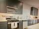 This kitchen features stainless steel appliances, sleek countertops, and ample cabinet space at 5888 Becklow Gardens Ave, Las Vegas, NV 89141