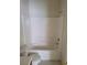 Full bathroom with a tiled shower-tub combo, toilet, and basic fixtures at 5969 High Steed St # 101, Henderson, NV 89011