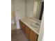 Standard bathroom with a single sink vanity and large mirror and bathtub and shower combo at 5969 High Steed St # 101, Henderson, NV 89011