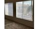 A room with two large windows, each with blinds, that bring in natural light at 5969 High Steed St # 101, Henderson, NV 89011