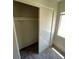 Bedroom closet with bi-fold doors and a single shelf with rod for ample storage space at 5969 High Steed St # 101, Henderson, NV 89011
