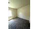 Bedroom with neutral walls, carpeted floor, and natural light from the window at 5969 High Steed St # 101, Henderson, NV 89011