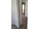Hallway with neutral walls and carpet leading to other rooms in the home at 5969 High Steed St # 101, Henderson, NV 89011