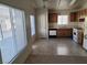 Spacious kitchen with tile flooring, neutral counters, and standard appliances at 5969 High Steed St # 101, Henderson, NV 89011