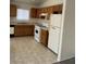 Functional kitchen with neutral cabinets and standard appliances at 5969 High Steed St # 101, Henderson, NV 89011