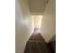 Carpeted staircase leading to the upper level of the home at 5969 High Steed St # 101, Henderson, NV 89011