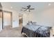 Cozy bedroom with neutral walls, a ceiling fan, and an ensuite bathroom entrance for added convenience at 6519 Summershade St, North Las Vegas, NV 89086