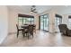 Cozy dining area with natural light, tile flooring and view of the outdoor patio through sliding glass doors at 6519 Summershade St, North Las Vegas, NV 89086