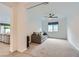 Living room featuring comfortable seating, neutral tones, plush carpeting, and an open layout leading to other rooms at 6519 Summershade St, North Las Vegas, NV 89086