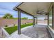 Covered patio with ceiling fan, offering a cool, shaded outdoor living space at 6519 Summershade St, North Las Vegas, NV 89086