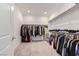 Spacious walk-in closet with ample shelving and hanging space for organized storage of clothing and accessories at 6519 Summershade St, North Las Vegas, NV 89086