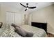 Inviting bedroom featuring ample closet space, warm lighting, and a cozy bed for a restful retreat at 6647 Montezuma Castle Ln, North Las Vegas, NV 89084