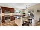 Bright kitchen featuring stainless steel oven and dark wood cabinets and counters at 6647 Montezuma Castle Ln, North Las Vegas, NV 89084
