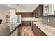 Kitchen with granite countertops, stainless appliances, custom cabinets, and a stylish backsplash at 6647 Montezuma Castle Ln, North Las Vegas, NV 89084