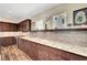 Bright kitchen showcasing granite counters, mosaic backsplash, custom cabinets, and stainless appliances at 6647 Montezuma Castle Ln, North Las Vegas, NV 89084