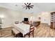 Open concept living room and dining room featuring wood floors and front entry way at 6647 Montezuma Castle Ln, North Las Vegas, NV 89084