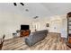 Spacious living room featuring wood laminate floors and access to the front entry at 6647 Montezuma Castle Ln, North Las Vegas, NV 89084