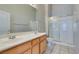 This bathroom features double sinks and a glass shower at 700 Carnegie St # 122, Henderson, NV 89052
