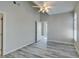 Spacious bedroom with vaulted ceiling, fan, and wood-look flooring at 700 Carnegie St # 122, Henderson, NV 89052