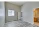 Bright bedroom with window and wood-look flooring throughout at 700 Carnegie St # 122, Henderson, NV 89052