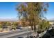 Expansive city view from a tree-lined street, presenting the community's beautiful natural setting at 700 Carnegie St # 122, Henderson, NV 89052
