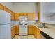 Kitchen features ample counter space, updated appliances, and wood cabinetry at 700 Carnegie St # 122, Henderson, NV 89052