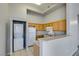 Close up on kitchen appliances with washer and dryer tucked in corner at 700 Carnegie St # 122, Henderson, NV 89052