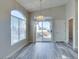 Living room features sliding glass door to a balcony, and light neutral colors at 700 Carnegie St # 122, Henderson, NV 89052