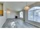 Living room featuring a fireplace, large arched window, and open floorplan at 700 Carnegie St # 122, Henderson, NV 89052