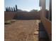 Large backyard featuring privacy walls and natural rock landscaping, ready for customization at 7112 Whitford St, Las Vegas, NV 89166