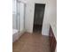 Bathroom with a shower, vanity, and tile floors, with a closet visible in the background at 7112 Whitford St, Las Vegas, NV 89166