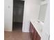 Bathroom with double sink vanity, tile flooring, and a closet at 7112 Whitford St, Las Vegas, NV 89166