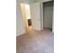 Bedroom view showcases closet and bathroom, and neutral carpet at 7112 Whitford St, Las Vegas, NV 89166