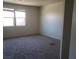 Bright bedroom with natural light and neutral carpet is a blank canvas awaiting your decor at 7112 Whitford St, Las Vegas, NV 89166