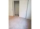Bedroom with closet and neutral carpeting providing a cozy feel at 7112 Whitford St, Las Vegas, NV 89166