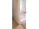 Hallway with tile flooring leading to a carpeted bedroom at 7112 Whitford St, Las Vegas, NV 89166
