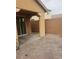 Paver patio and covered porch with sliding glass door to the home at 7112 Whitford St, Las Vegas, NV 89166