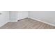 Bedroom features gray vinyl floors, white trim and doors, and a light gray wall color at 7432 Red Plumeria Ave, Las Vegas, NV 89113