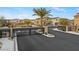 Community gated entrance showing the secure and upscale neighborhood with beautiful homes and landscaping at 7432 Red Plumeria Ave, Las Vegas, NV 89113
