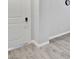 Hallway with wood-look flooring and white trim at 7432 Red Plumeria Ave, Las Vegas, NV 89113