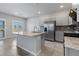 Kitchen with granite countertops, stainless steel appliances, tile floors, recessed lighting, and gray cabinets at 7432 Red Plumeria Ave, Las Vegas, NV 89113