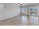Bright living room with tile flooring, recessed lighting, and large windows providing natural light at 7432 Red Plumeria Ave, Las Vegas, NV 89113