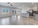 Spacious living room features tile floors, recessed lighting, and a large glass slider leading to the exterior at 7432 Red Plumeria Ave, Las Vegas, NV 89113