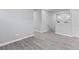 Large loft area with contemporary wood-look flooring and staircase at 7432 Red Plumeria Ave, Las Vegas, NV 89113