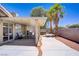 This backyard features desert landscaping, a covered patio, and privacy walls at 7713 White Grass Ave, Las Vegas, NV 89131