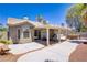 Backyard showing desert landscaping, covered patio, and exterior of the property at 7713 White Grass Ave, Las Vegas, NV 89131