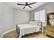 Cozy bedroom with a full size bed, ceiling fan and a modern ceiling fan at 7713 White Grass Ave, Las Vegas, NV 89131