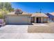 Charming single-story home featuring a two-car garage and desert landscaping for easy maintenance at 7713 White Grass Ave, Las Vegas, NV 89131