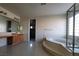 Relaxing bathroom featuring a soaking tub and separate glass-enclosed shower, perfect for unwinding after a long day at 7728 Villa De La Paz Ave, Las Vegas, NV 89131